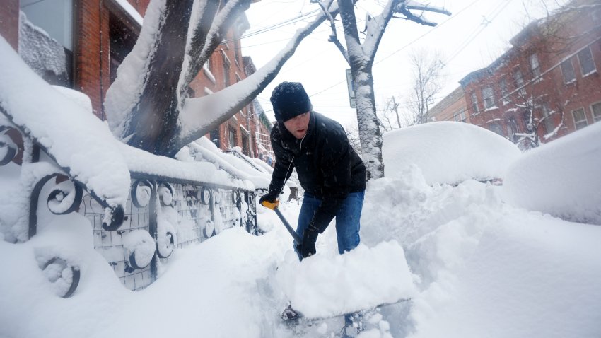 Matt Powers shovels a Jersey City sidewalk, Monday, February 23, 2026 after more than a foot of snow had blanketed the area.