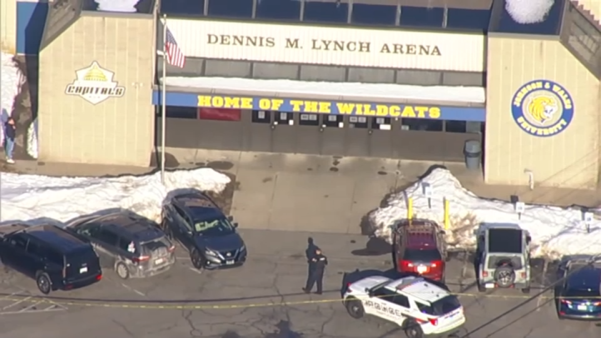 Three people are dead, including the suspect, in a shooting during a high school hockey game in Pawtucket, Rhode Island, on Monday, police said.