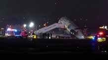 An Air Canada Jet sits on the runway at LaGuardia Airport, Monday, March 23, 2026, after colliding with a Port Authority vehicle in New York.