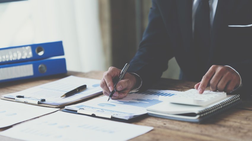 Businessman analysis marketing plan, Accountant calculate financial report, Accounting Calculating Cost Economic Financial data.