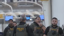 ICE agents patrol at John F. Kennedy International Airport in New York City on Monday.