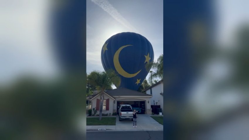 A hot-air balloon landed in the backyard of a home in Temecula on Saturday, April 18, 2026.