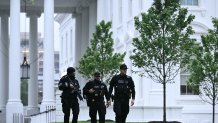 Secret Service agents are seen after a lockdown was lifted at the White House in Washington, DC, on May 23, 2026.