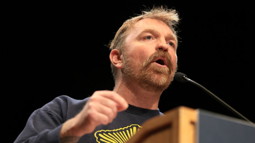 ORONO, MAINE – MAY 24: Democratic U.S. Senate candidate Graham Platner speaks at a “Fighting Oligarchy” tour stop held by Sen. Bernie Sanders (I-VT) at the Collins Center for the Arts on the University of Maine campus on May 24, 2026 in Orono, Maine. Platner is the presumptive Democratic nominee and will face incumbent Sen. Susan Collins (R-ME) for Maine’s U.S. Senate seat in the general election.  (Photo by Joe Raedle/Getty Images)