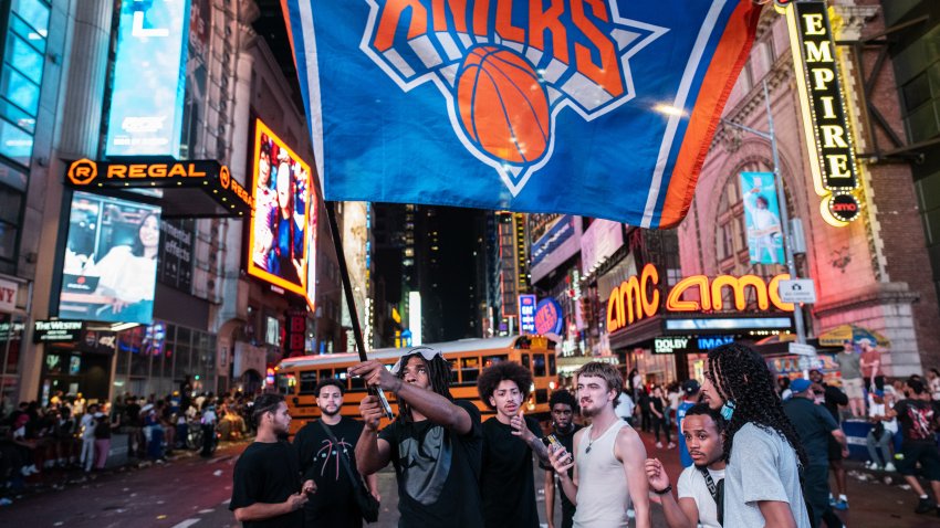 Fans celebrate as the New York Knicks defeat the San Antonio Spurs in Game 5 of the NBA Finals to win the title in New York, US, early on Sunday, June 14, 2026. The New York Knicks ended one of the longest championship droughts in the NBA, bringing relief to their long-suffering fans. Photographer: Victor J. Blue/Bloomberg via Getty Images
