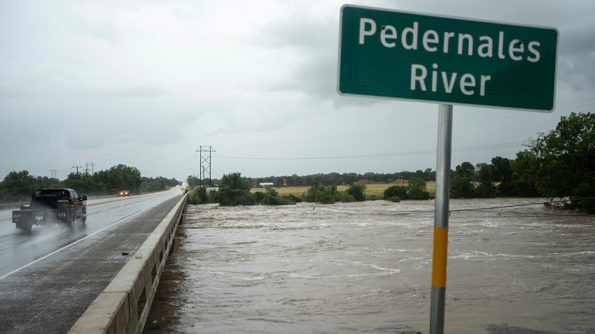 The Pedernales River floods underneath State Highway 87 on Thursday, July 16, 2026, in Fredericksburg, Texas.
