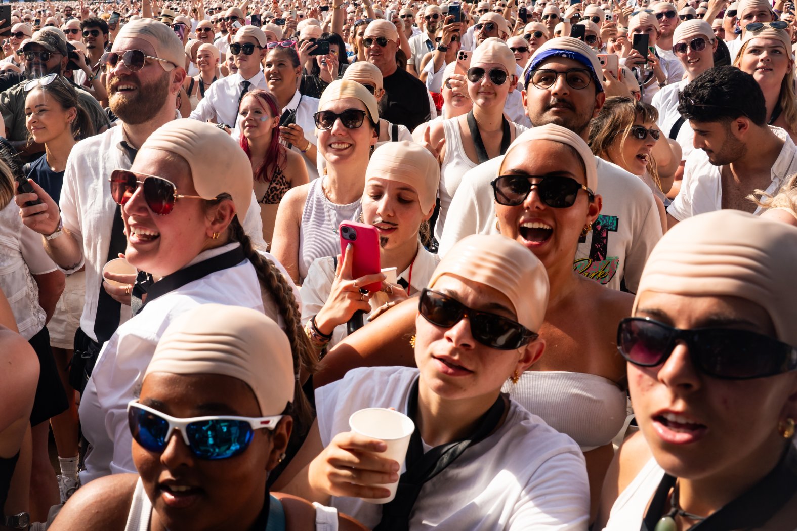 Caps Rappper Pitbull sets world record for largest gathering of people in bald caps ...