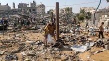 GAZA CITY, GAZA - AUGUST 1: Residents inspect the damage caused by Israeli airstrikes last night on residential buildings in the Safatawi area on August 1, 2026 in Gaza City, Gaza. Israel continues military actions in Gaza during the fragile easefire agreement which is frequently contested, and marred by mutual accusations of violations.  (Photo by Ahmad Hasaballah/Getty Images)