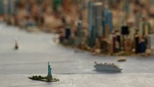 The Statue of Liberty is seen on a large model of the New York City, made by Joe Macken, at the Museum of the City of New York in New York, Monday, Sept. 14, 2026. (AP Photo/Seth Wenig)