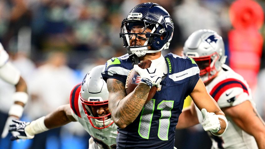 Jaxon Smith-Njigba #11 of the Seattle Seahawks runs the ball to score.