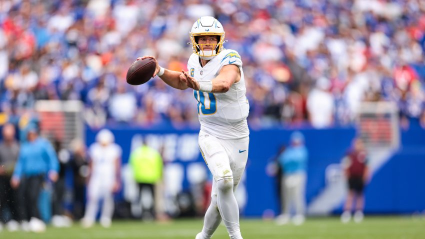 Justin Herbert #10 of the Los Angeles Chargers throws a pass.