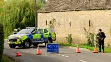 FAIRFORD, ENGLAND - SEPTEMBER 27: A police roadblock is in place on September 27, 2026 in Fairford, United Kingdom. Police have declared a major incident after evacuating residents from their homes in Whelford, a village about one mile from RAF Fairford, a military base that hosts U.S. Air Force bombers involved in the Iran conflict. Several men have been arrested on suspicion of offences under the explosives act, and the Army's specialist explosive ordnance disposal team are examining a number of vehicles in the area. (Photo by David Bown/Getty Images)
