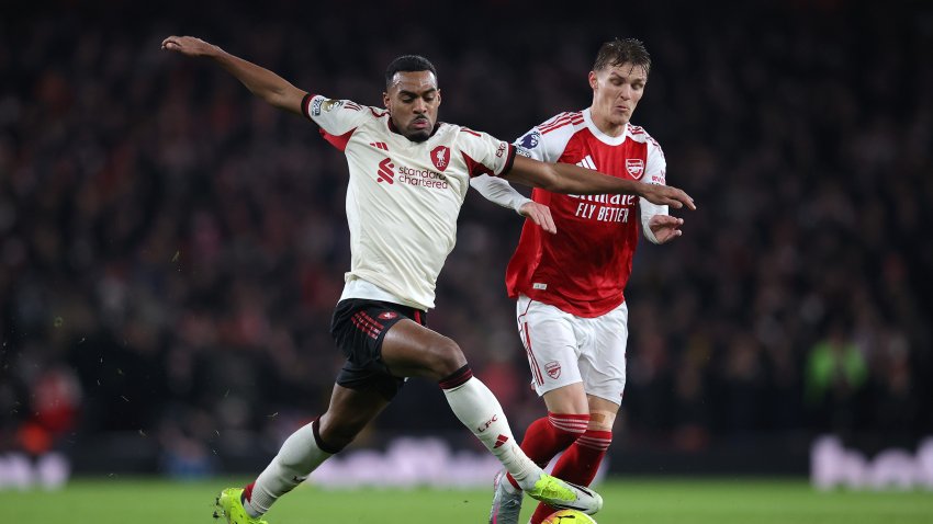 Ryan Gravenberch of Liverpool holds off a challenge from Martin Odegaard of Arsenal.