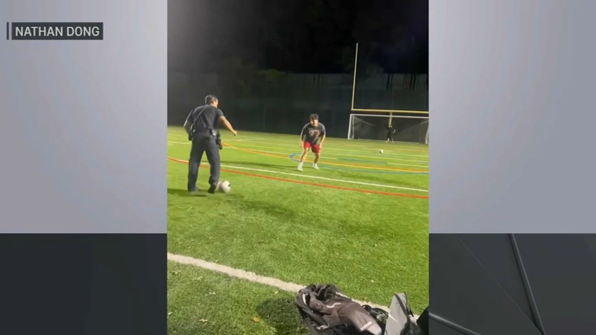 Suffolk County police officers playing soccer with teens in Centereach, NY