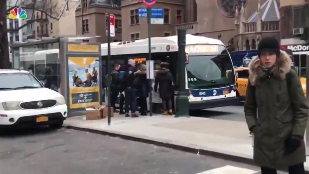 [NY]    Pedestrians race with the MTA bus to demonstrate slow service