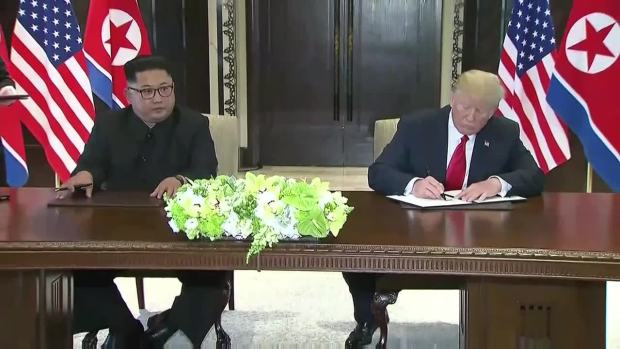 [NATL] WATCH: Trump, Kim Jong Un Sign Document at Historic Summit