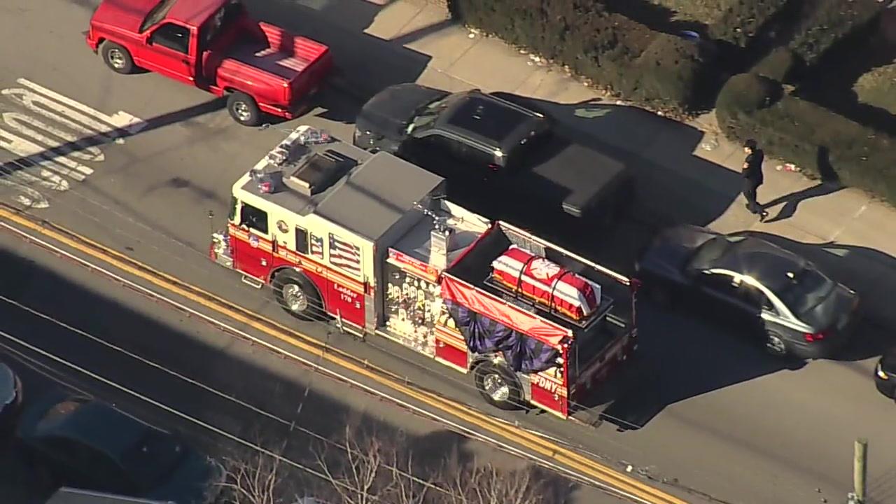 Procession Leads FDNY Hero's Flag-Draped Casket to Funeral