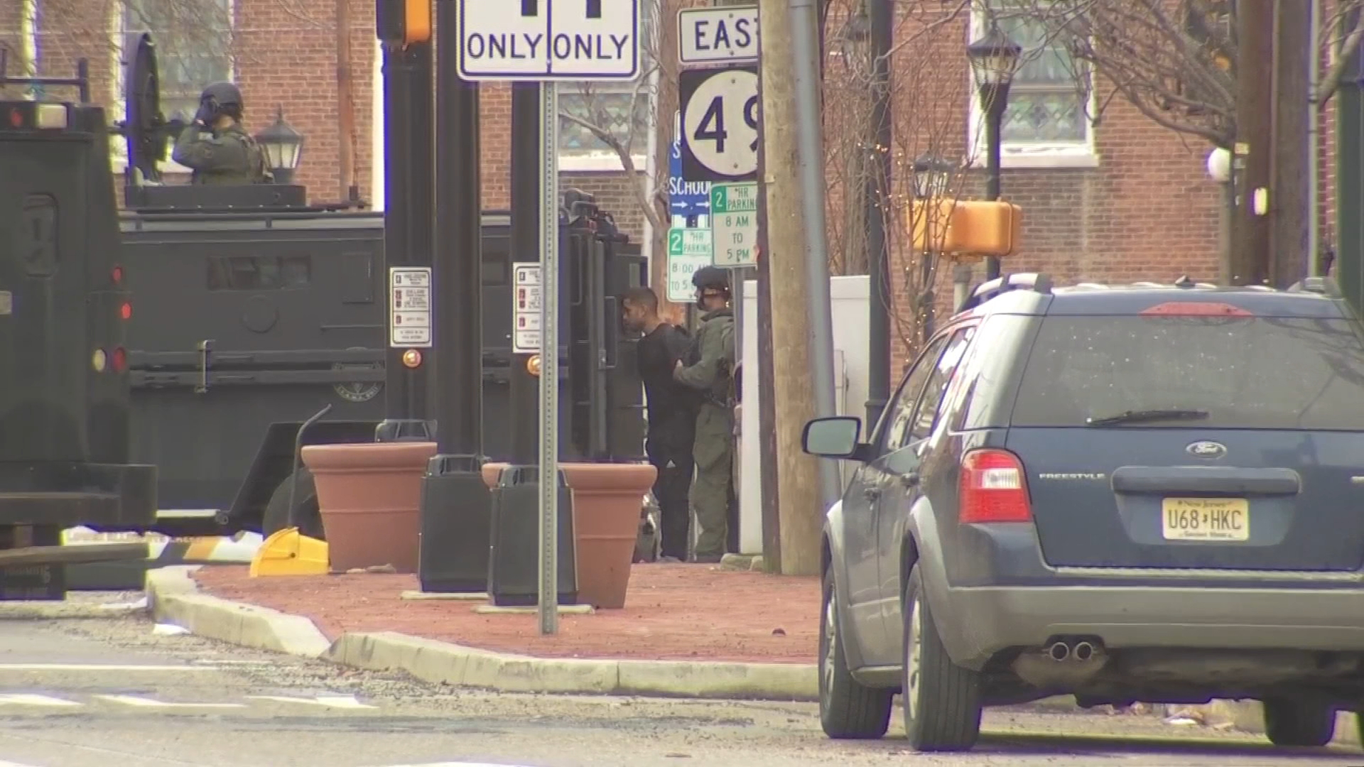 Gunman in Custody After Firing From Rooftop, Police Say